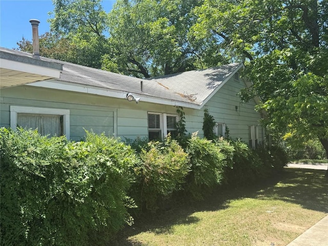 1711 Singleton Ave, Austin, TX 78702 - view of home's exterior with a lawn