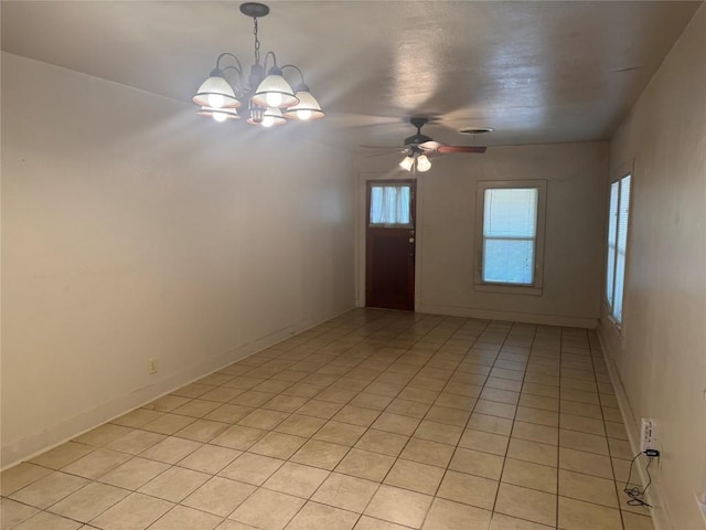 1711 Singleton Ave, Austin, TX 78702 - empty room with a chandelier, ceiling fan, and light tile patterned floors