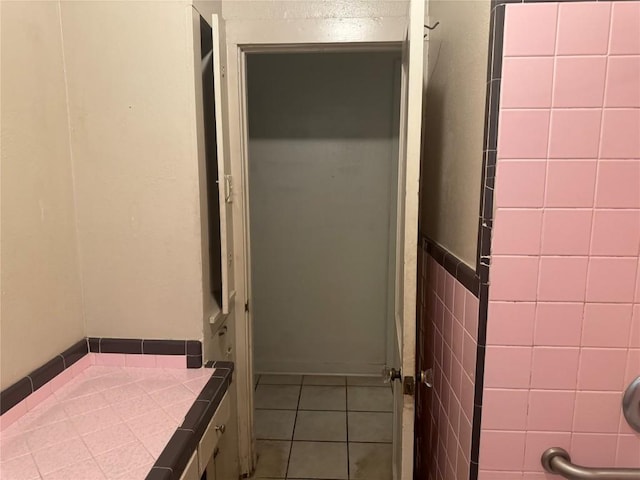 1711 Singleton Ave, Austin, TX 78702 - full bathroom featuring tile patterned floors and a shower