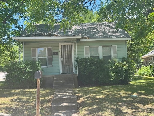 1711 Singleton Ave, Austin, TX 78702 - bungalow-style house with a front yard and entry steps