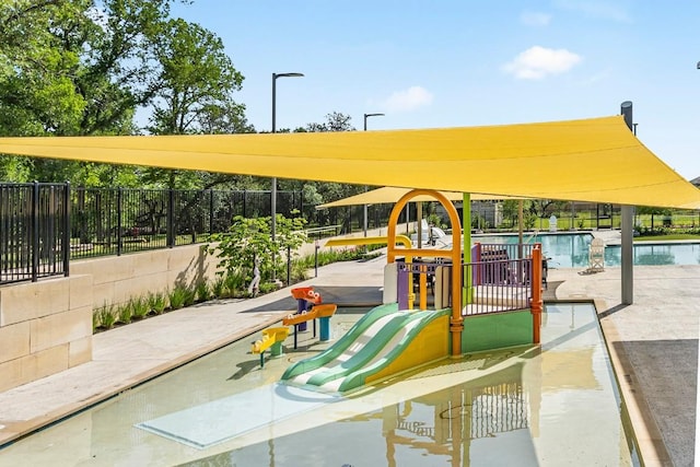 120 Morrison Dr, Jarrell, TX 76537 - view of play area with a community pool and a patio area