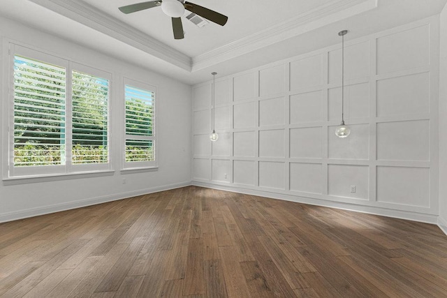 406 Woodside Ter, Austin, TX 78738 - unfurnished room featuring crown molding, wood-type flooring, ceiling fan, and a decorative wall