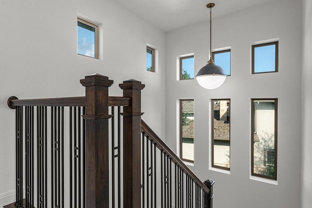 staircase with a high ceiling