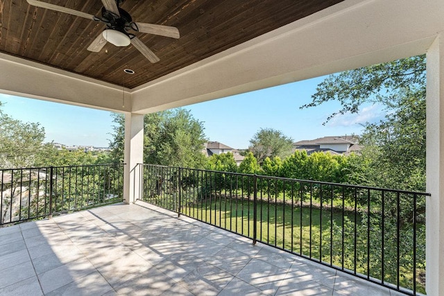 view of patio / terrace featuring a ceiling fan and a balcony
