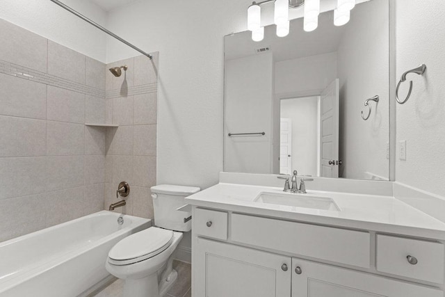 bathroom featuring toilet, vanity, and shower / bath combination