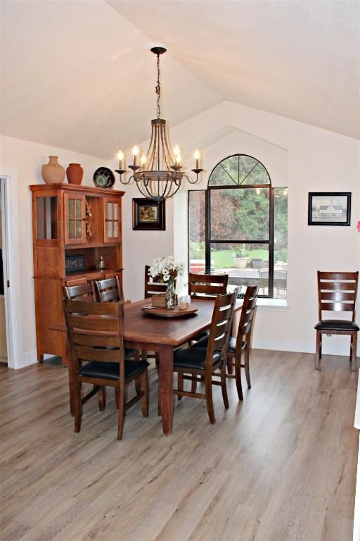 3616 Arrowhead Cir, Round Rock, TX 78681 - dining room featuring a chandelier, lofted ceiling, and light wood-type flooring