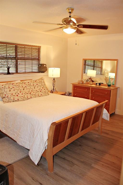 3616 Arrowhead Cir, Round Rock, TX 78681 - bedroom with wood finished floors and a ceiling fan