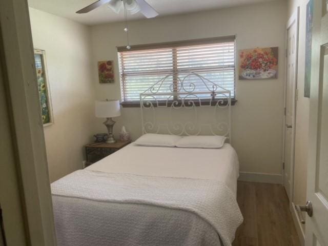 3616 Arrowhead Cir, Round Rock, TX 78681 - bedroom with wood finished floors, baseboards, and a ceiling fan