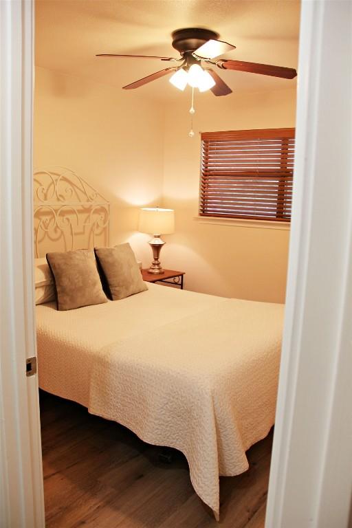 3616 Arrowhead Cir, Round Rock, TX 78681 - bedroom featuring wood finished floors and a ceiling fan