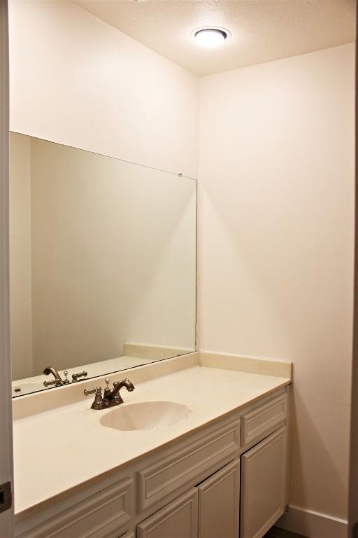 3616 Arrowhead Cir, Round Rock, TX 78681 - bathroom with vanity and baseboards