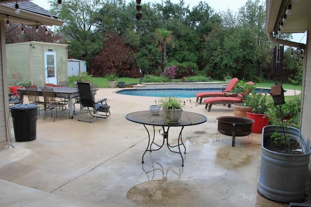 3616 Arrowhead Cir, Round Rock, TX 78681 - view of patio / terrace featuring a storage shed, an outdoor pool, and outdoor dining area