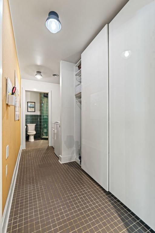 202 Tanglewood Dr, Fredericksburg, TX 78624 - hallway featuring tile patterned flooring and baseboards