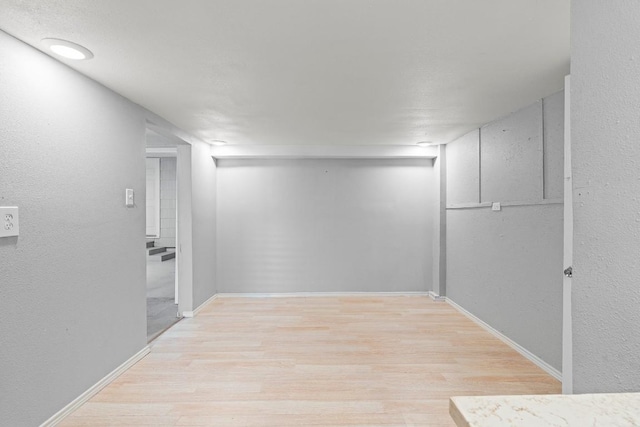 201 N Bowie Ave, Cameron, TX 76520 - hallway featuring wood finished floors and baseboards
