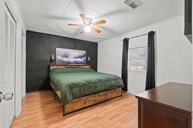 201 N Bowie Ave, Cameron, TX 76520 - bedroom with light wood-style flooring and ceiling fan