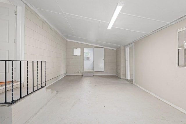 201 N Bowie Ave, Cameron, TX 76520 - unfurnished room with concrete flooring and lofted ceiling