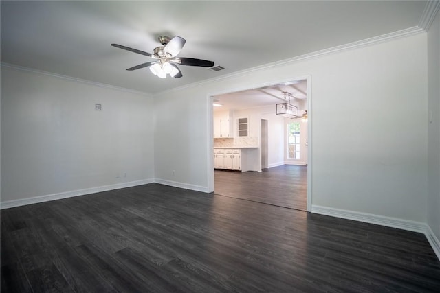 908 Kent St, Taylor, TX 76574 - unfurnished room featuring a ceiling fan, dark wood-style floors, ornamental molding, and a chandelier