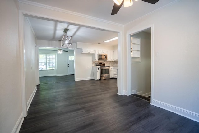 908 Kent St, Taylor, TX 76574 - unfurnished living room with a ceiling fan, dark wood-style flooring, and ornamental molding