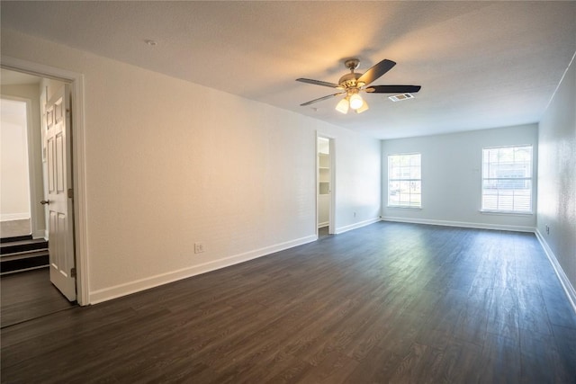 908 Kent St, Taylor, TX 76574 - empty room featuring dark wood finished floors and ceiling fan