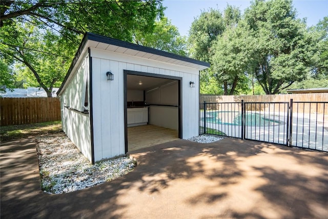 908 Kent St, Taylor, TX 76574 - view of shed with a fenced backyard