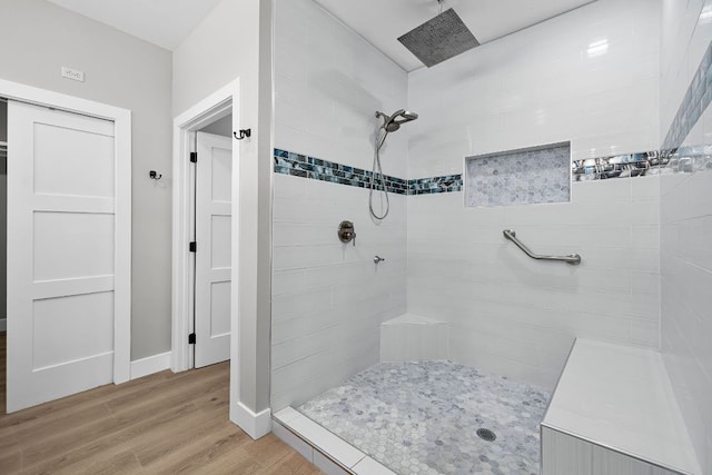 12935 Prairie Cir Unit 3641, Kempner, TX 76539 - bathroom with wood finished floors, tiled shower, and baseboards