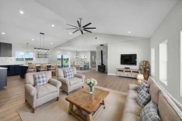 12935 Prairie Cir Unit 3641, Kempner, TX 76539 - living room with a wood stove, light wood-type flooring, a ceiling fan, recessed lighting, and a chandelier