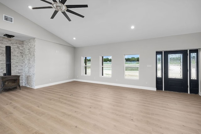 12935 Prairie Cir Unit 3641, Kempner, TX 76539 - unfurnished living room with lofted ceiling, ceiling fan, light wood-style floors, a wood stove, and recessed lighting