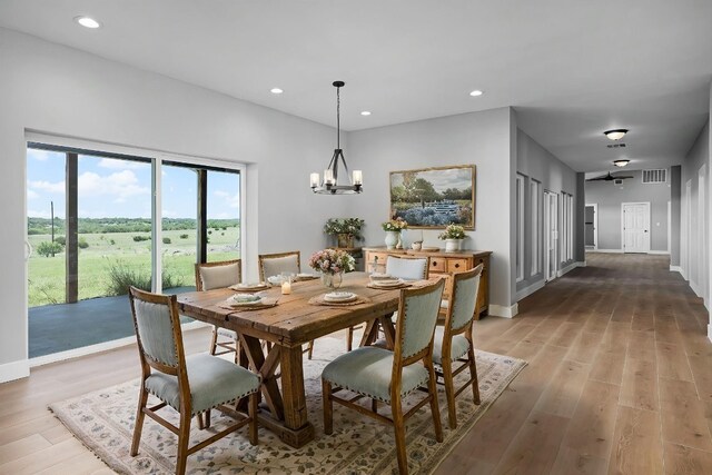 12935 Prairie Cir Unit 3641, Kempner, TX 76539 - dining room with light wood-type flooring, a chandelier, recessed lighting, and baseboards
