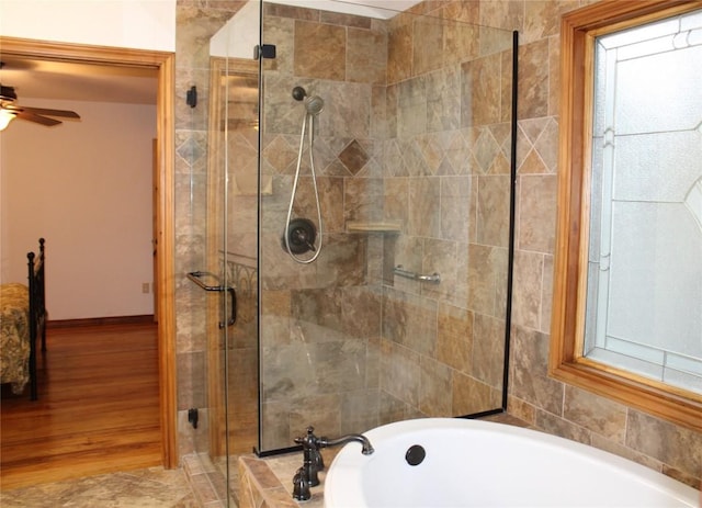 704 Marquis Ln, Cedar Park, TX 78613 - full bath featuring a stall shower, a bath, and a ceiling fan