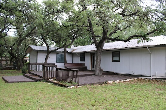 704 Marquis Ln, Cedar Park, TX 78613 - back of property with a jacuzzi, a deck, a metal roof, and a yard