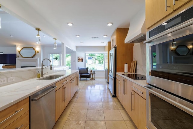 4902 Pony Chase, Austin, TX 78727 - kitchen with stainless steel appliances, custom range hood, light stone countertops, open floor plan, and light tile patterned floors