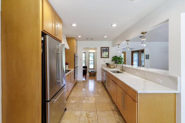 4902 Pony Chase, Austin, TX 78727 - kitchen with appliances with stainless steel finishes, light countertops, pendant lighting, recessed lighting, and a peninsula