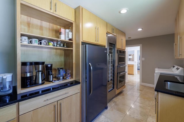 4902 Pony Chase, Austin, TX 78727 - kitchen with freestanding refrigerator, washer and dryer, light brown cabinetry, a warming drawer, and recessed lighting