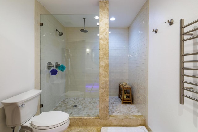 4902 Pony Chase, Austin, TX 78727 - bathroom featuring a towel warmer, a tile shower, and recessed lighting