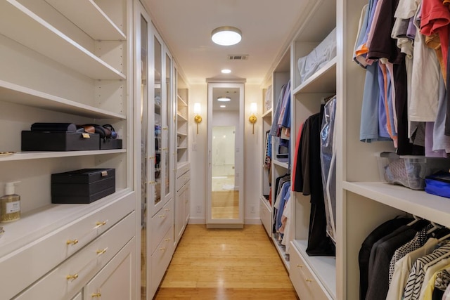 4902 Pony Chase, Austin, TX 78727 - walk in closet with light wood finished floors