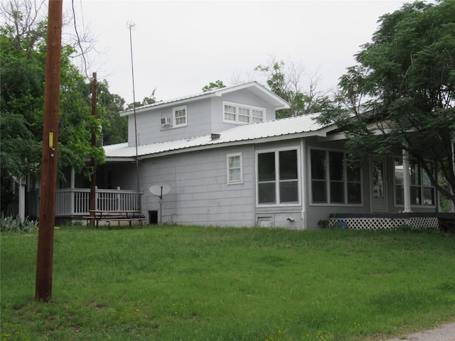 163 Cricket St, Tow, TX 78672 - rear view of property featuring a yard and metal roof