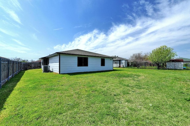 rear view of property featuring central AC