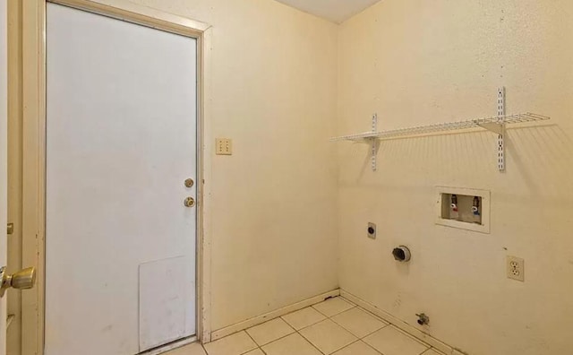 1919 Castle Gate Cir, San Marcos, TX 78666 - washroom featuring washer hookup, light tile patterned flooring, and hookup for an electric dryer