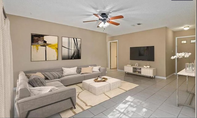 1919 Castle Gate Cir, San Marcos, TX 78666 - living area with a ceiling fan and a textured ceiling