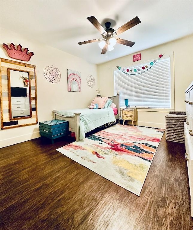 2355 County Road 130, Hutto, TX 78634 - bedroom featuring wood finished floors, baseboards, and a ceiling fan