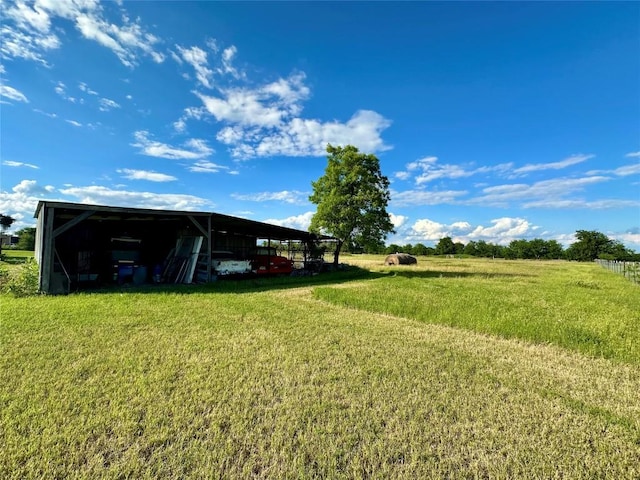 2355 County Road 130, Hutto, TX 78634 - view of green lawn with a detached carport, an outdoor structure, and a pole building
