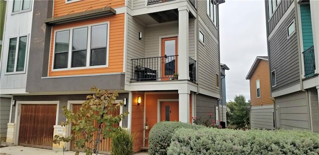 2020 Tripshaw Ln Unit 65C, Austin, TX 78741 - view of front of property featuring a balcony and a garage