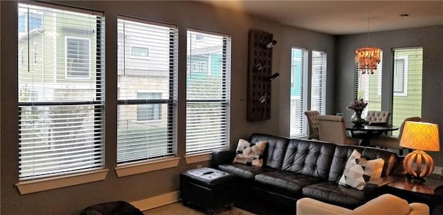 2020 Tripshaw Ln Unit 65C, Austin, TX 78741 - living area with a chandelier and baseboards