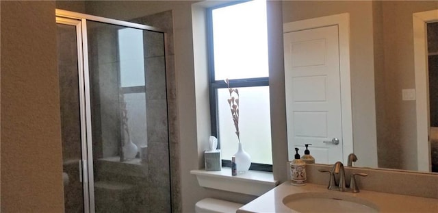2020 Tripshaw Ln Unit 65C, Austin, TX 78741 - full bathroom featuring a stall shower, toilet, and vanity