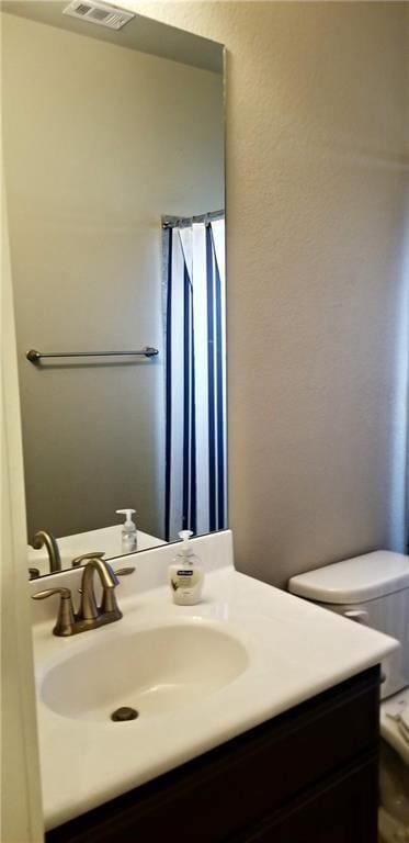 2020 Tripshaw Ln Unit 65C, Austin, TX 78741 - bathroom featuring vanity and toilet