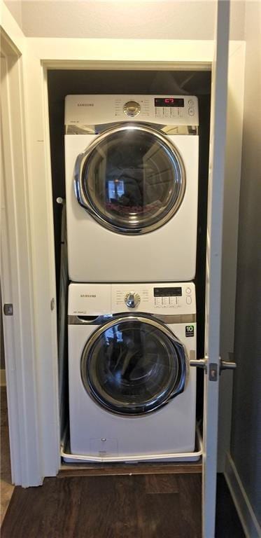 2020 Tripshaw Ln Unit 65C, Austin, TX 78741 - laundry room with stacked washer / drying machine and wood finished floors