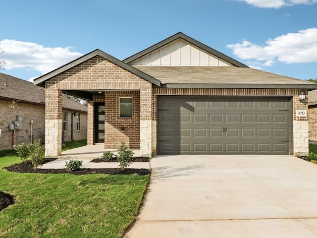 825 Sun Grove Trl, Georgetown, TX 78628 - view of front of home featuring brick siding, a garage, and driveway