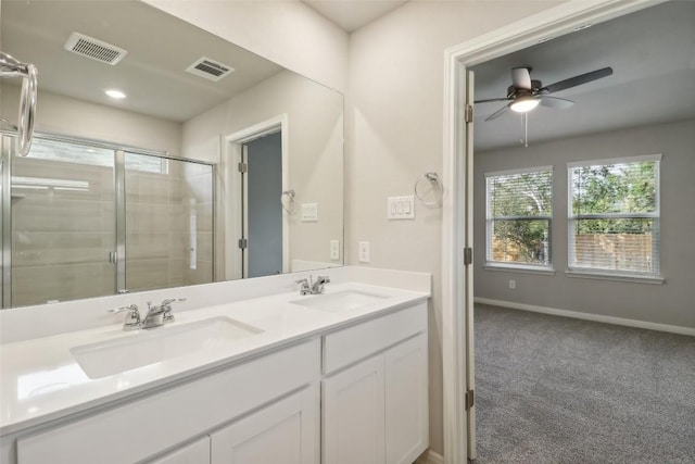 825 Sun Grove Trl, Georgetown, TX 78628 - bathroom with healthy amount of natural light, a stall shower, double vanity, and baseboards