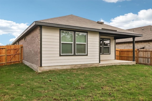 825 Sun Grove Trl, Georgetown, TX 78628 - back of property featuring a patio and brick siding