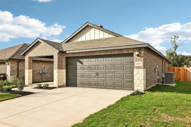 825 Sun Grove Trl, Georgetown, TX 78628 - ranch-style house with brick siding, central AC, a garage, driveway, and board and batten siding