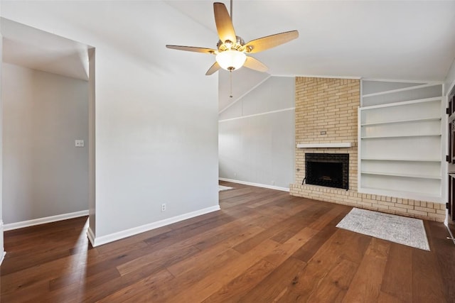 8500 Woodstone Dr, Austin, TX 78757 - unfurnished living room featuring lofted ceiling, a ceiling fan, baseboards, hardwood / wood-style flooring, and built in features